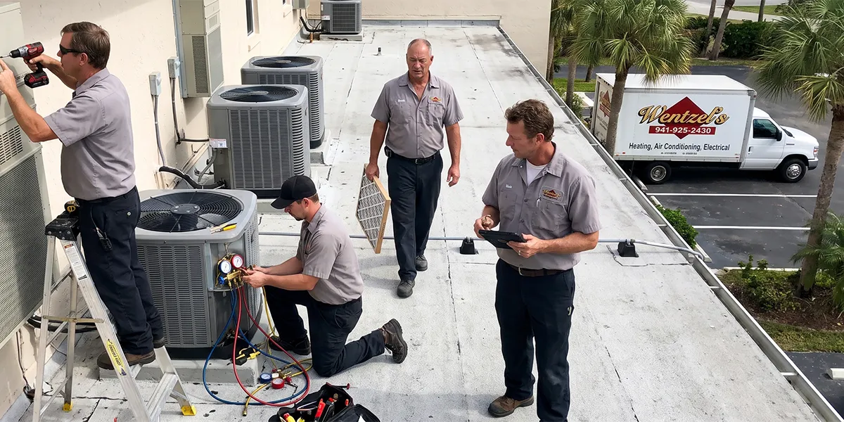 Wentzel's maintenance crew servicing AC systems at a Sarasota condominium property