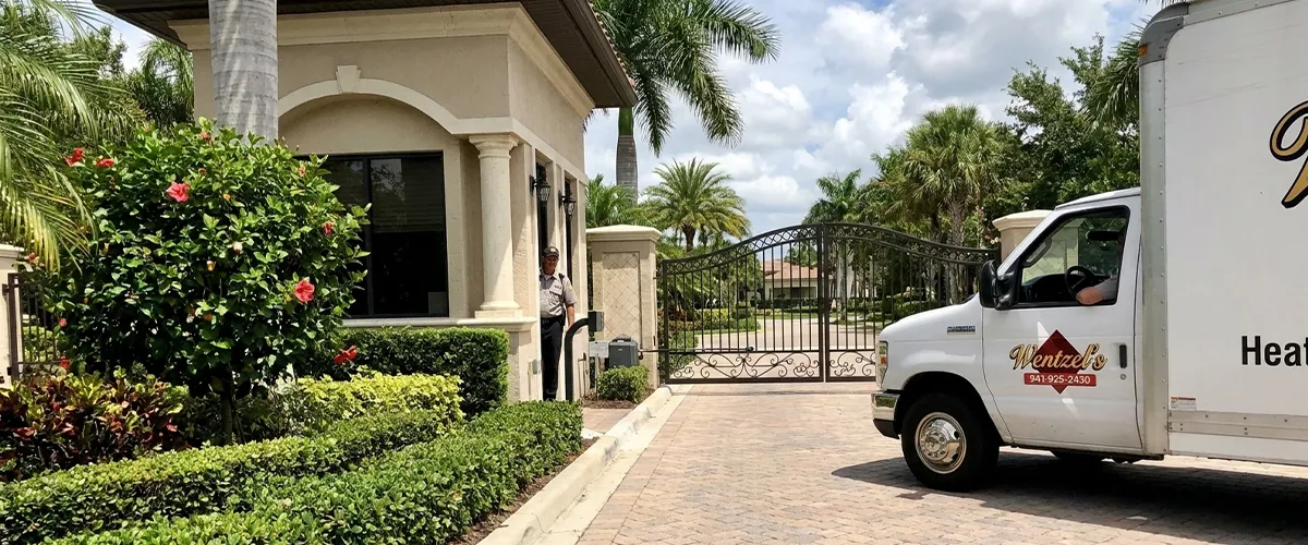 Wentzel's technician diagnosing an AC unit in a Lakewood Ranch home