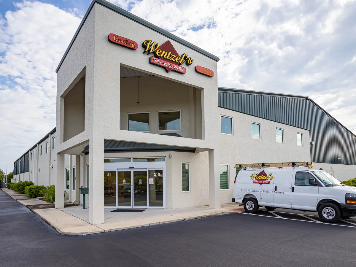 Wentzel's Heating & Air Conditioning headquarters at 51 Alafia Drive, Sarasota, with a service van parked out front