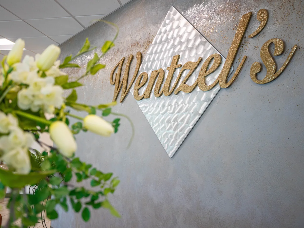 The Wentzel's name on the lobby wall at the company's Sarasota headquarters
