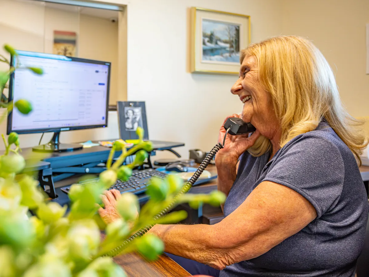 Wentzel's office team member answering a customer call in Sarasota