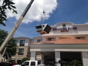 Crane lifting new Air Conditioners at Spring Hill Suites Sarasota