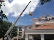 Crane lifting new Air Conditioning Units at Spring Hill Suites Sarasota